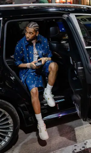 Key Glock wearing Louis Vuitton shirt