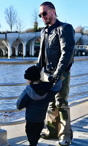 J Balvin’s Outfit in Vetements Jacket, Louis Vuitton Pants & Prada Eyewear (2024)