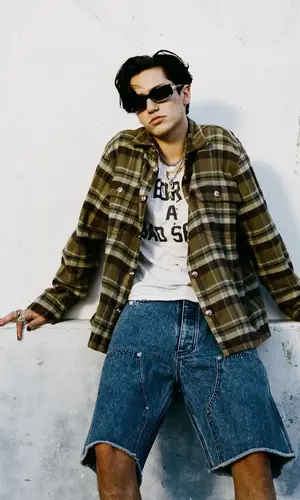 Lil Huddy wearing Chrome Hearts jewelry