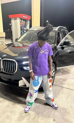 LPB Poody wearing Prada sneakers