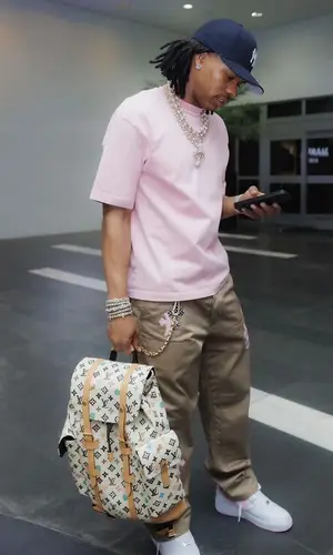 Lil Baby wearing Louis Vuitton backpack