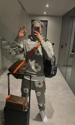 Alejandro Garnacho’s Outfit in Denim Tears Hoodie, Nike Sneakers & Louis Vuitton Backpack (2024)