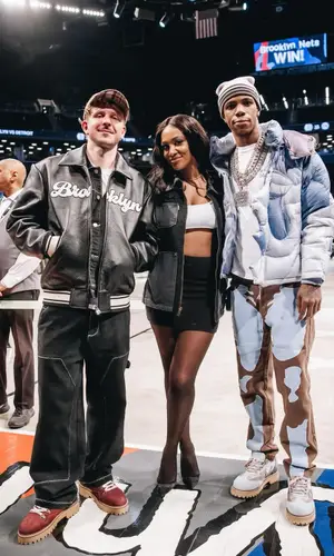 A Boogie Wit Da Hoodie wearing KidSuper boots