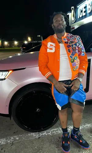 Peezy wearing Nike sock