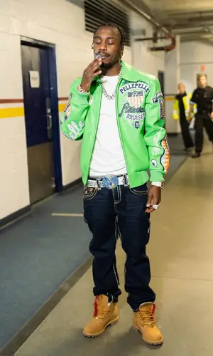 Lil Tjay wearing Timberland boots