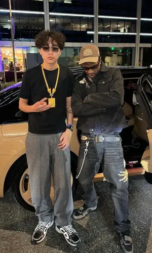 Travis Scott wearing Stussy cap