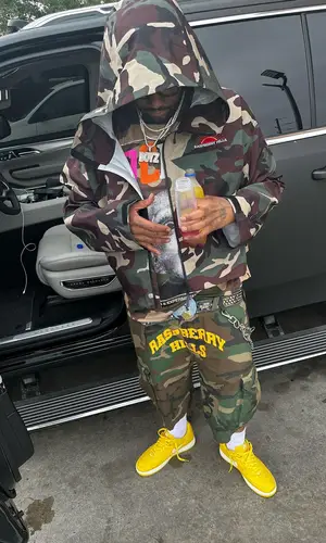 Peezy wearing B.B. Simon belt