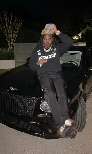 Lucki’s Outfit in Prada Pants, Nike Sneakers & Gucci Cap (2024)