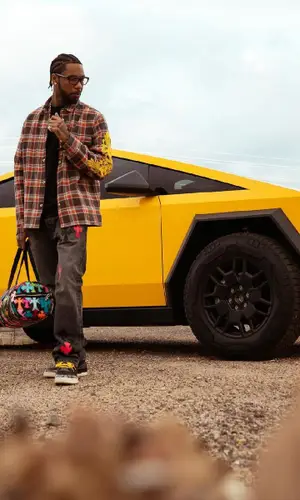 Key Glock wearing Chrome Hearts bag