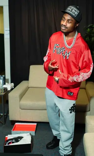Lil Tjay wearing Chrome Hearts jersey