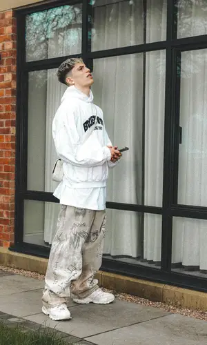 Alejandro Garnacho’s Outfit in Balenciaga Hoodie & Goyard Bag (2024)