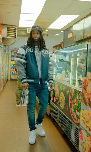 Polo G wearing New Era cap