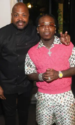Jacquees wearing Louis Vuitton top