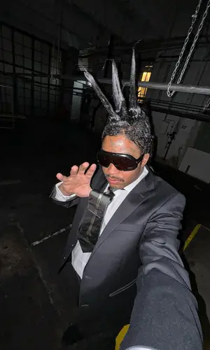 Lil Tracy’s Outfit in Vivienne Westwood Suit, Tom Ford Eyewear & Vibram Sandals (2024)