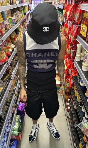 Central Cee wearing Chanel top