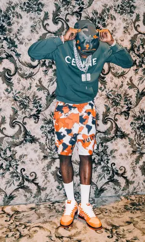 A Boogie Wit Da Hoodie wearing Louis Vuitton shorts