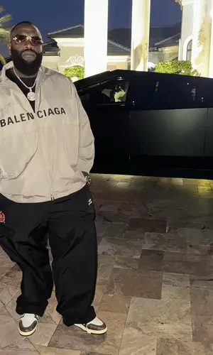 Rick Ross wearing Balenciaga pants