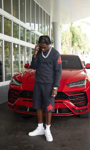Lil Tjay wearing Chrome Hearts shorts