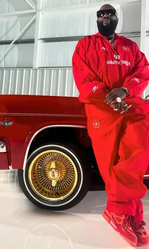 Rick Ross wearing Balenciaga pants