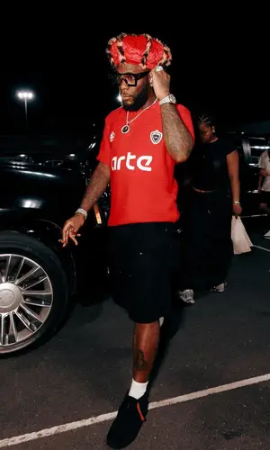 Burna Boy wearing Arte Antwerp shirt