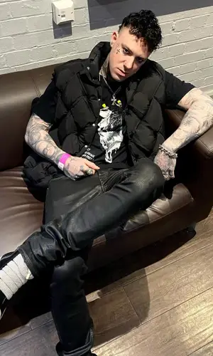 Brennan Savage wearing Rick Owens jeans