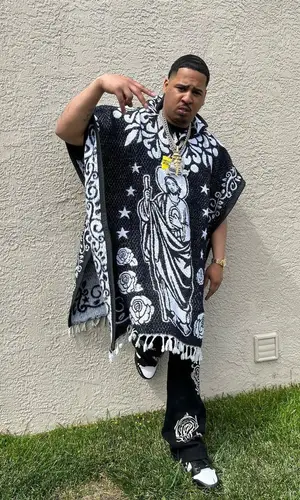 Ralfy The Plug wearing The Plug Sneaker sneakers
