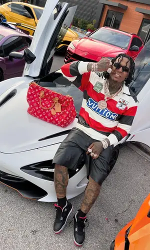 Moneybagg Yo wearing Louis Vuitton bag
