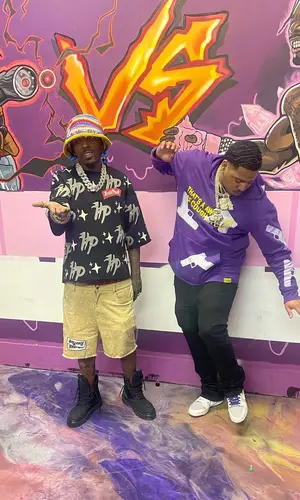 Sauce Walka wearing Louis Vuitton boots
