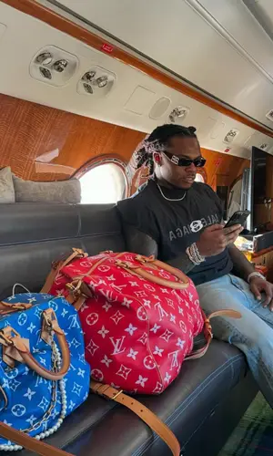 Gunna wearing Louis Vuitton bag