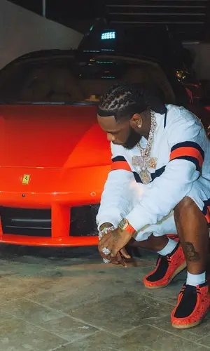 Burna Boy wearing Clarks boots