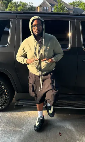 Peezy wearing Rick Owens jacket