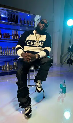 Rick Ross’ Outfit in Celine Sweater, Thrt Denim Jeans & Chanel Sneakers (2024)
