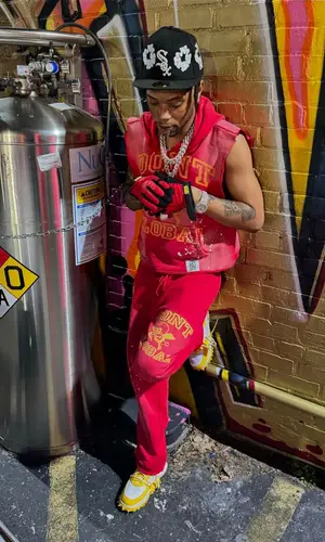 Lil Migo wearing Supreme glov