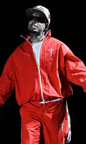21 Savage wearing Mitchell & Ness cap