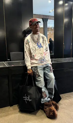 A Boogie Wit Da Hoodie wearing Louis Vuitton boots