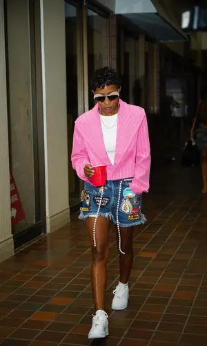 DeJ Loaf wearing Arrival Worldwide shorts