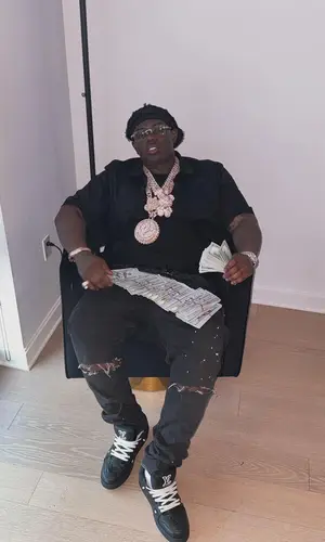 Sheff G wearing Purple Brand jeans