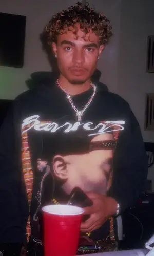 Riot wearing Barriers Worldwide hoody