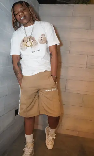 K Hood wearing Palm Angels t-shirt