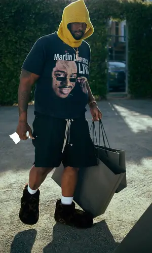 Peezy wearing Louis Vuitton boots