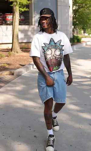Duke Dennis wearing Pas de Mer shorts