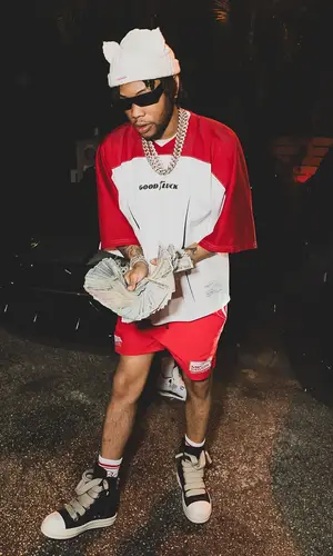 Lil Migo wearing Mr. Saturday jersey