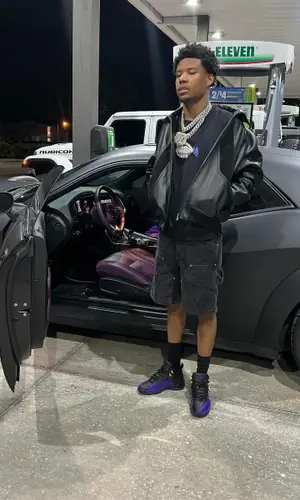 Nardo Wick wearing Louis Vuitton shorts