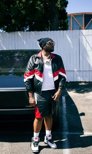 Peezy wearing Bottega Veneta backpack