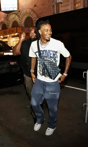 Ja Morant’s Outfit in Retrovert T-Shirt, Bape Sneakers & Louis Vuitton Bag (2024)