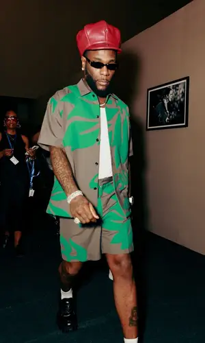 Burna Boy wearing Sacai shirt