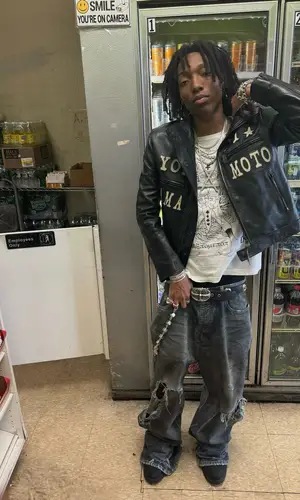 Lil Tecca wearing Chrome Hearts boots