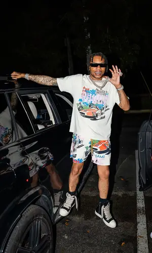 Lil Migo wearing Rhude swimwear