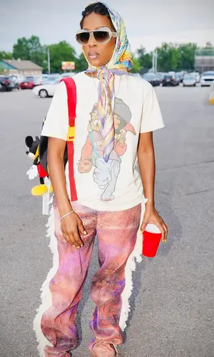 DeJ Loaf wearing Disney bag