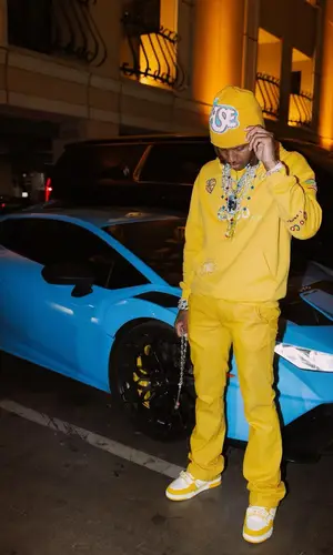 Lil Durk’s Outfit in Chanel Hoodie, Gallery Dept. Pants & Pharrell Williams (2024)